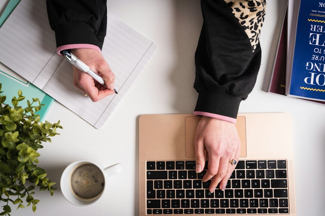 writer at desk with notebook